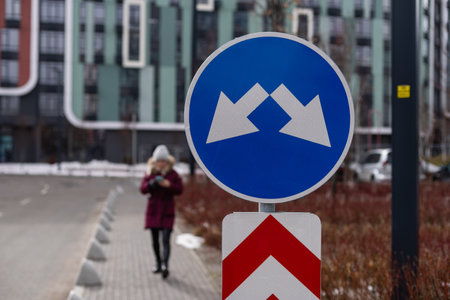 Regulatory signs, proceed in direction indicated by arrow traffic signの写真素材