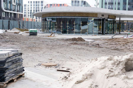 Repair of the sidewalk. Worker stonemason repair the sidewalk for Laying paving slabの写真素材