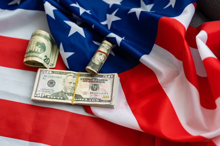 top view american flag on us dollars background