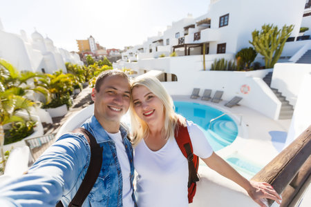 happy loving couple hug on balcony terrace with sea view
