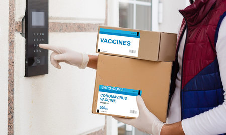 the man delivers the vaccine. Placing VACCINE label on the cardboard box