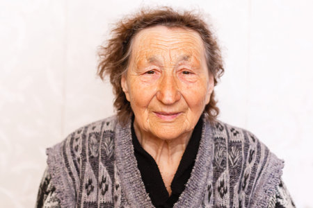 technology, old age and people concept - happy senior woman having video call at home in evening