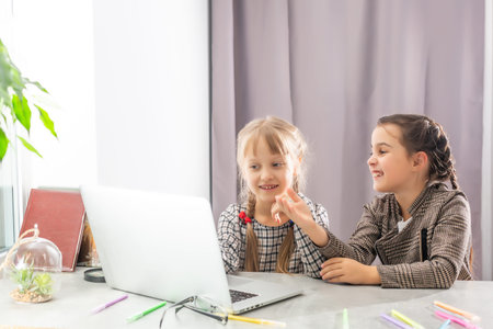 two little girls studying online. Distance Learning Online, e-learning, concept