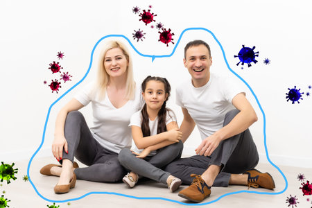 Family during virus and flu outbreak. Virus and illness protection, quarantine. People on white wall backgroundの写真素材