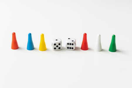 Game cubes, chips, hourglass on a white background. The concept of home Board games, classes at home with children, developmental training, logic games. Flatlay and space for text.の写真素材
