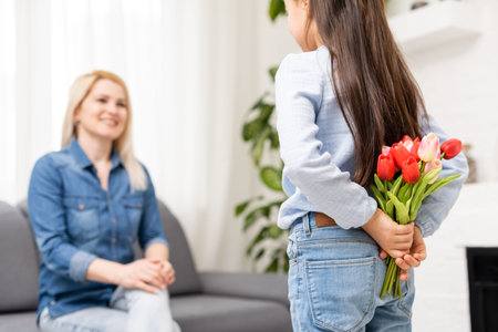 Mother smiling with her daughter at home