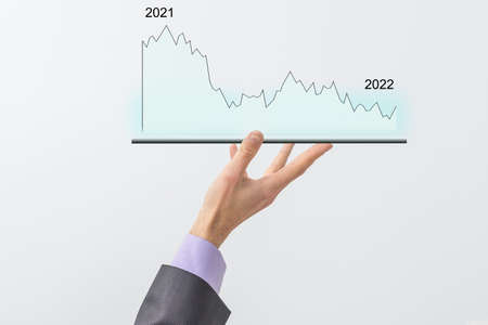 mans hand holding a tablet with growth chart. Analysis conceptの写真素材