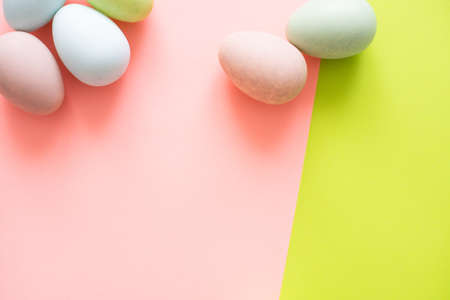 Colorful easter eggs on a green background hard lightの写真素材