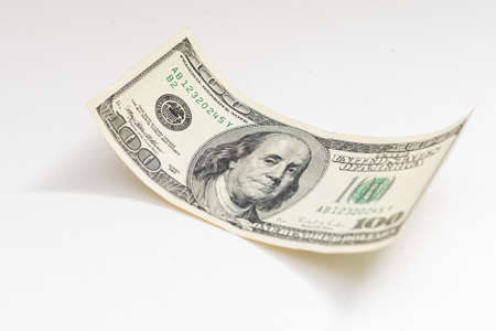 bill one hundred dollars on a white backgroundの写真素材