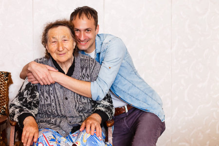 Closeup of elderly woman with young man