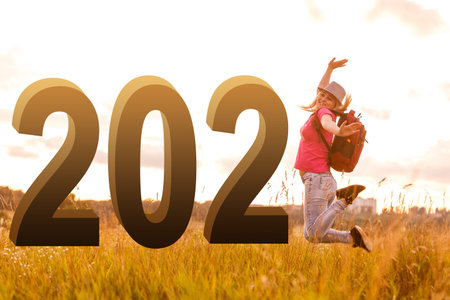 woman in field with number 2022, Female capturing the sunrise. copy space