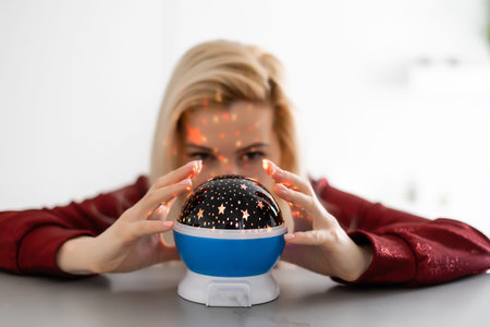 Beautiful woman holding a magical ball