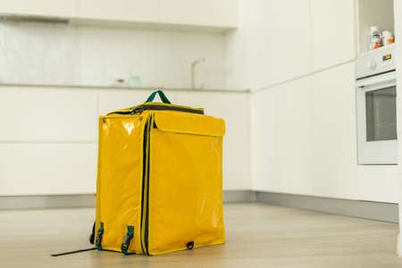 Closeup of delivery backpack, yellow food delivery bagの写真素材