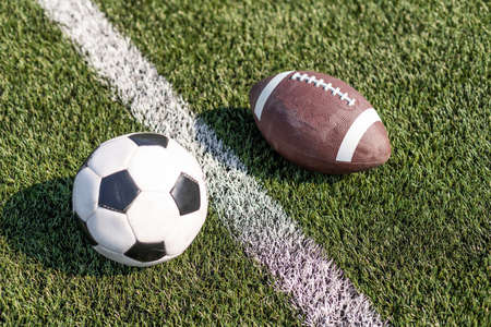 soccer field and stadium, rugby ball and soccer ball at the stadiumの写真素材