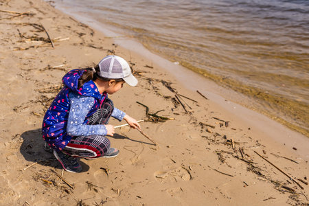 Little girl a park near the riverの写真素材