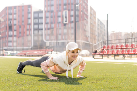 Sport. Fitness Girl Doing Stretching Workout. Fashion Sporty Woman With Strong Muscular Body...