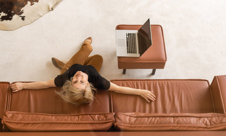 Hipster woman use Laptop huge Loft Studio. Student Researching Process Work. Young Business Woman...
