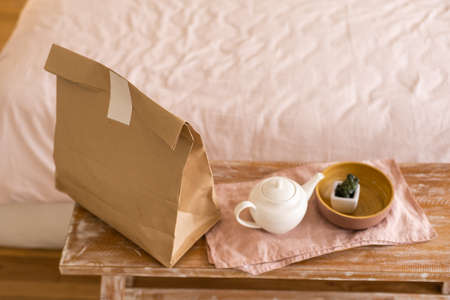 Paper packages with groceries on kitchen tableの写真素材