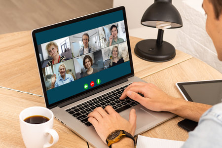 Virtual meeting online. Video conference by laptop. Online business meeting. On the laptop screen,...
