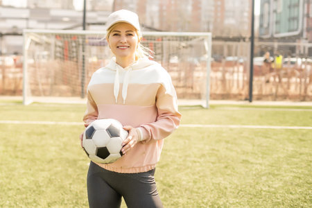 sexy fitness woman in sportswear. athletic lady warming up on stadium running track. female athlete...