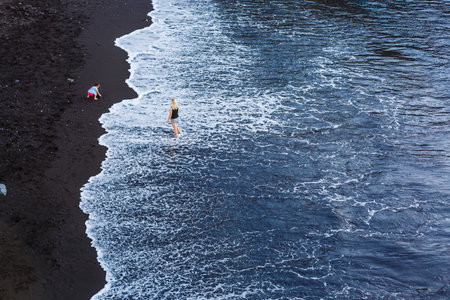 Family holiday on Tenerife, Spain, Europe. Mother and daughter outdoors on ocean. Portrait travel...