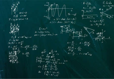 Handwritten equations on a green blackboardの写真素材