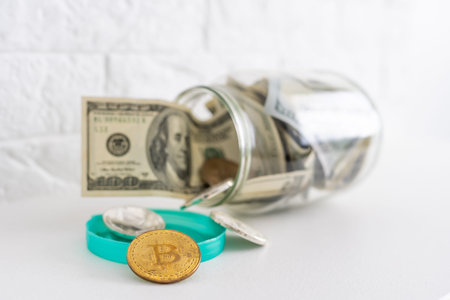 Saving money coin in jar. Symbol of investing, keeping money concept. Collecting cash banknotes in...