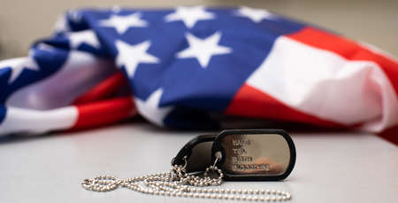 Army tokens on American national flag backgroundの写真素材