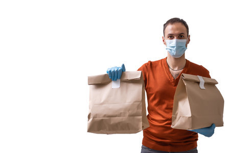 Delivery man in protective mask at virus season. Man isolated on white background