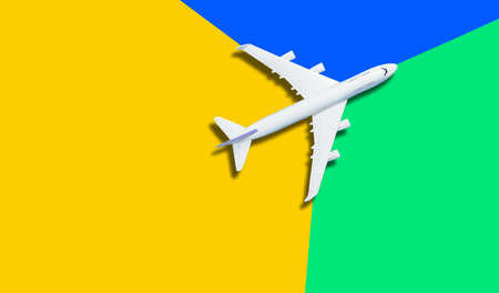 Travel theme with miniature airplane from aboveの写真素材