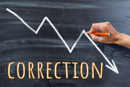 Finance business graph. Declining Line graph drawn with chalk on blackboardの写真素材