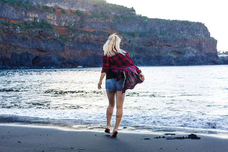 beautiful alone sensual girl on the beachの写真素材