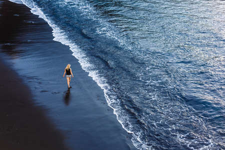beautiful alone sensual girl on the beachの写真素材