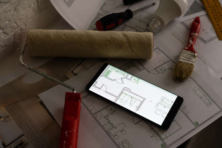 Construction blueprints with tools, top viewの写真素材