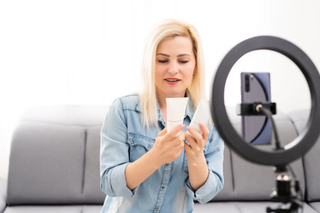 Female Vlogger Recording Broadcast At Home