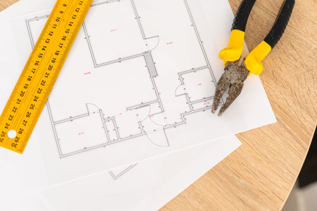 Tools and papers with sketches on the table