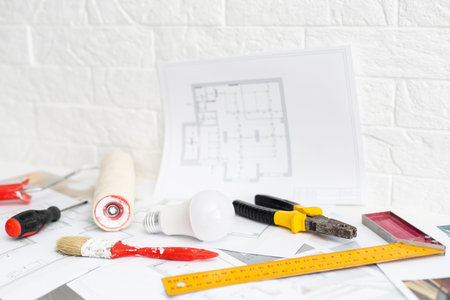 Architect workplace top view. Architectural project, blueprints, blueprint rolls on table....