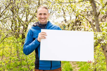 man with canvas mockup. Photo Mockup. The man hold canvas. For canvas design.の写真素材