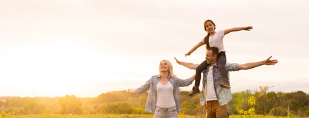 Young happy family in a field