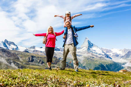 Family trekking, motmother, father and daughter campingの写真素材