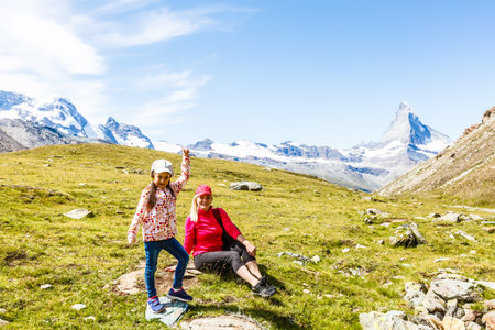 Family trekking, mother and daughter campingの写真素材