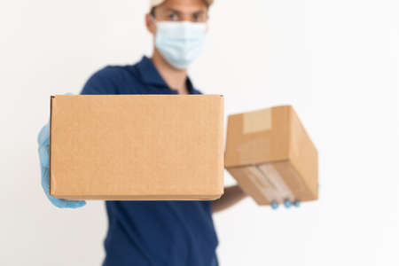 handsome young delivery man portrait on whiteの写真素材