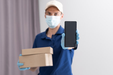 handsome young delivery man portrait on whiteの写真素材