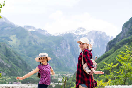Traveling mother and daughter in the mountains of albaniaの写真素材
