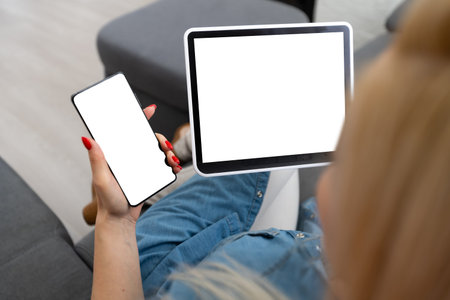 Intelligent home concept. Young woman using smart home application on a tablet