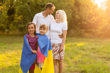 family with the flag of ukraine. Happy Independence Day of Ukraine. National Flag Day. Love for the homeland and symbols. Copy space.の写真素材