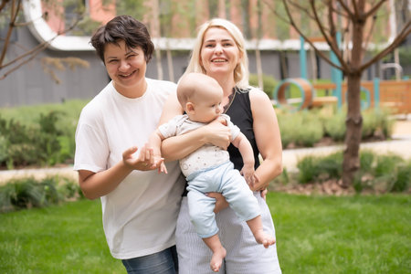 Happy Family Posing for A Portrait in the Park.