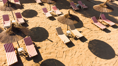 straw umbrellas on the sandy beach