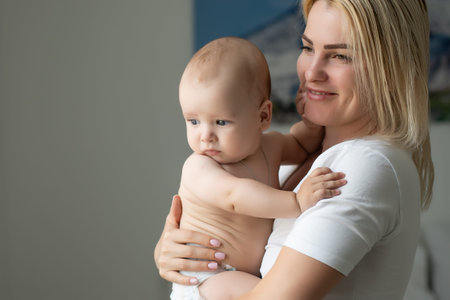happy mother holding her baby