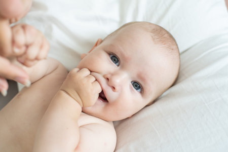 Portrait of a mother with her 6 months old baby, top view point